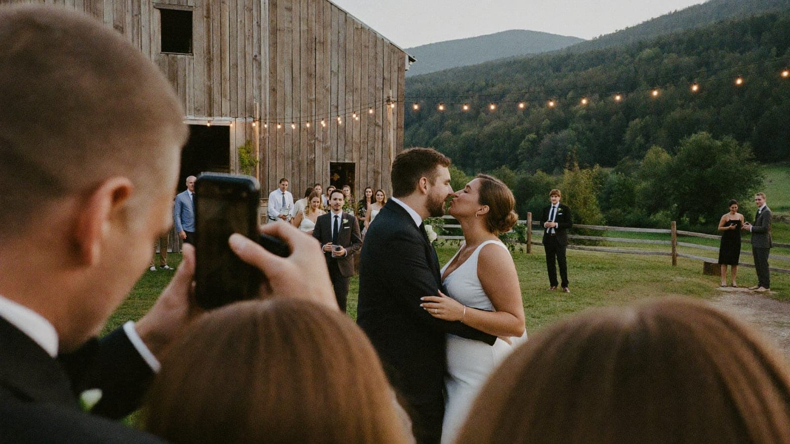 The wedding photographer captures the couple's first dance in the evening