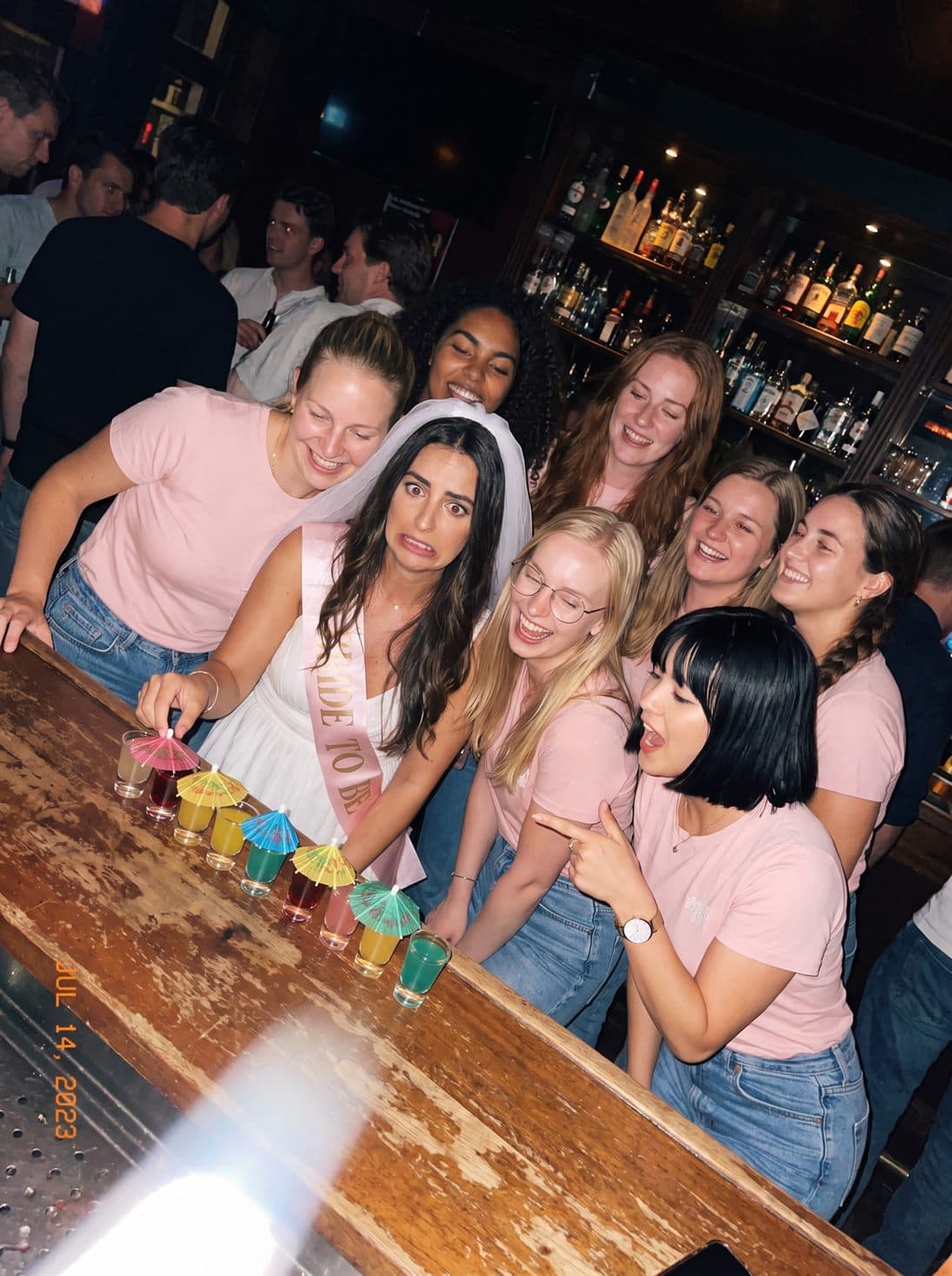 Shots with little umbrellas at the bar