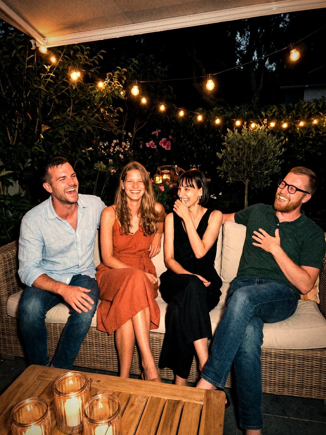 The whole gang in fits of laughter on the lounge sofa
