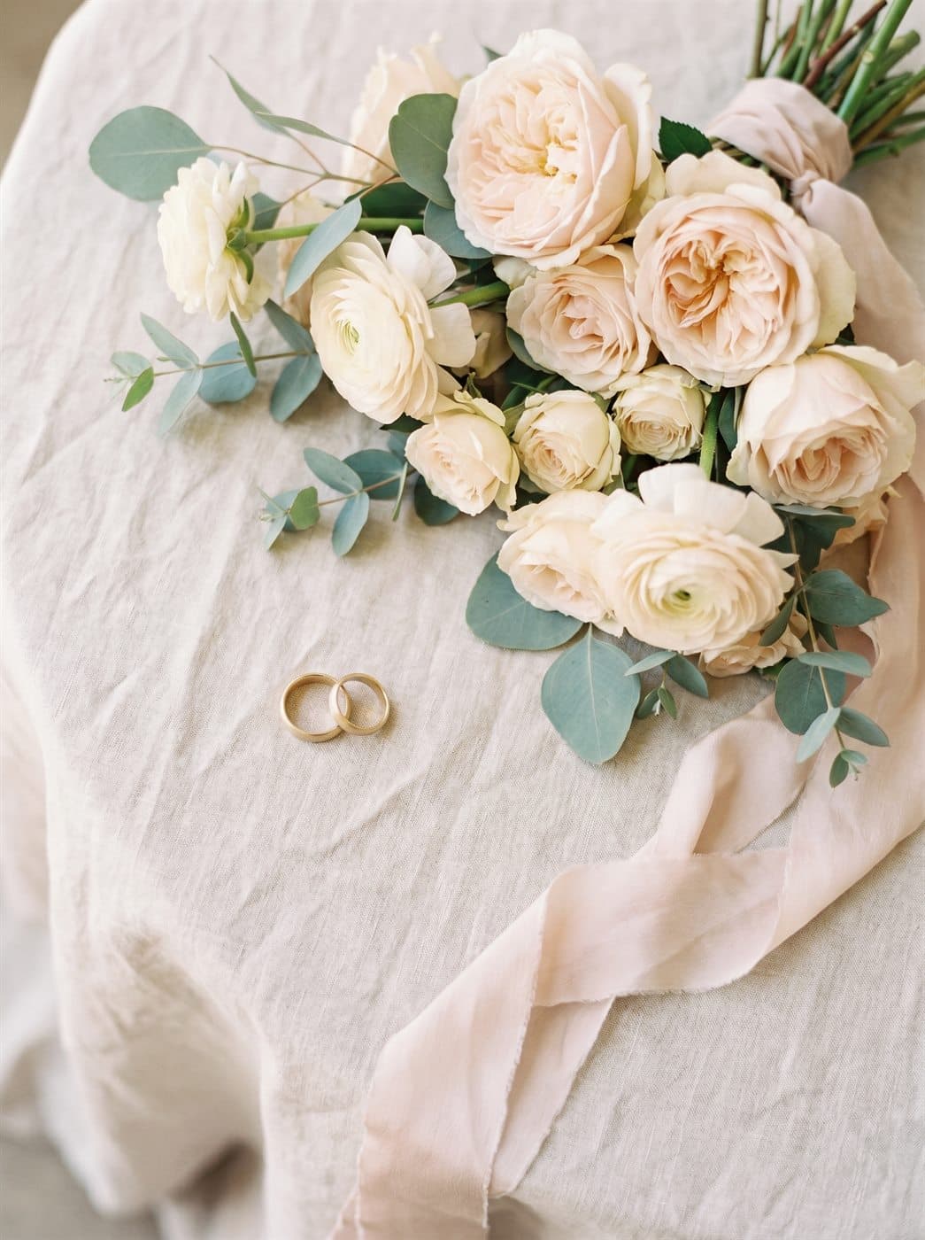 The rings beside the bouquet