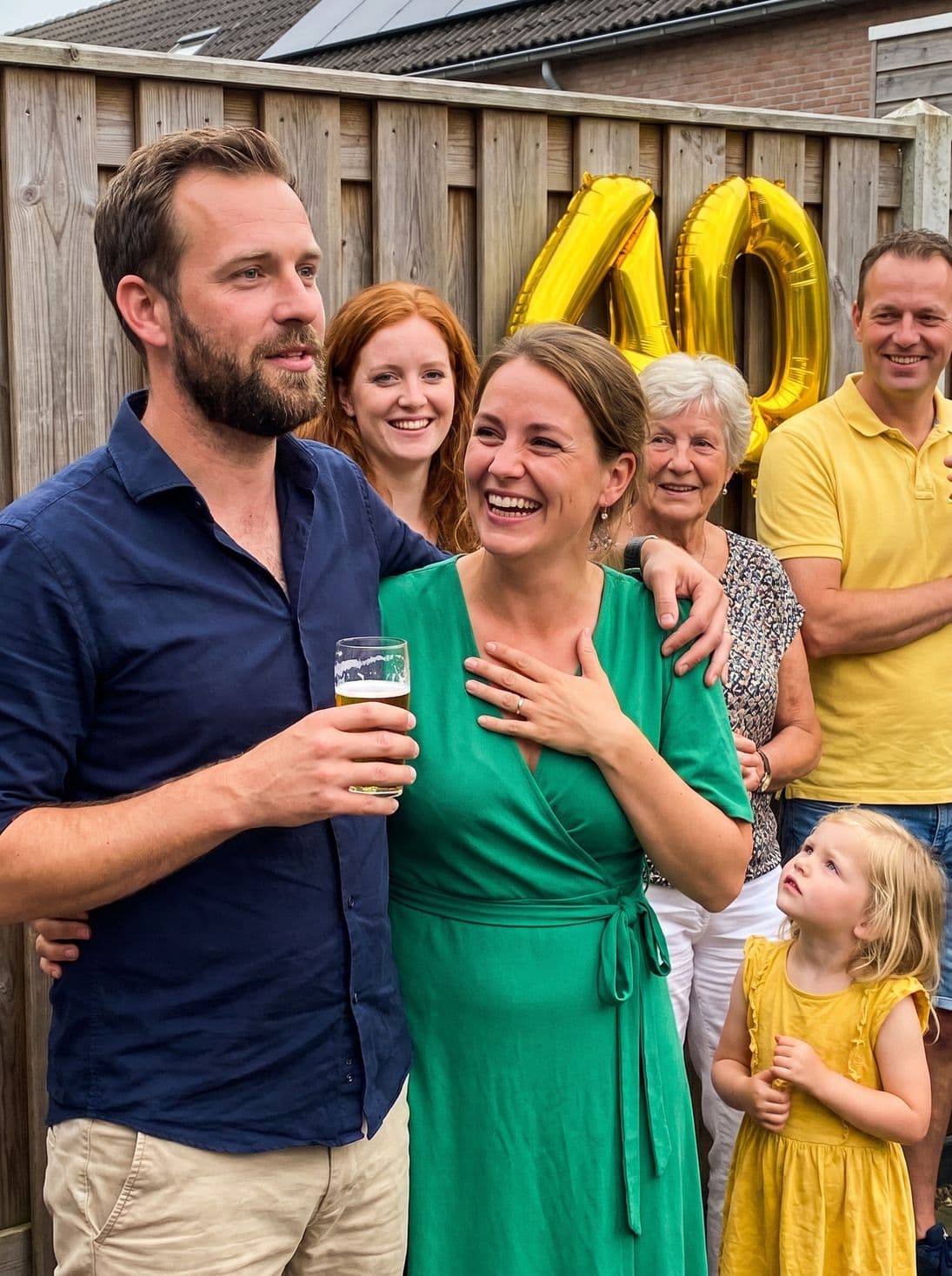 A toast to the birthday girl, an arm around her