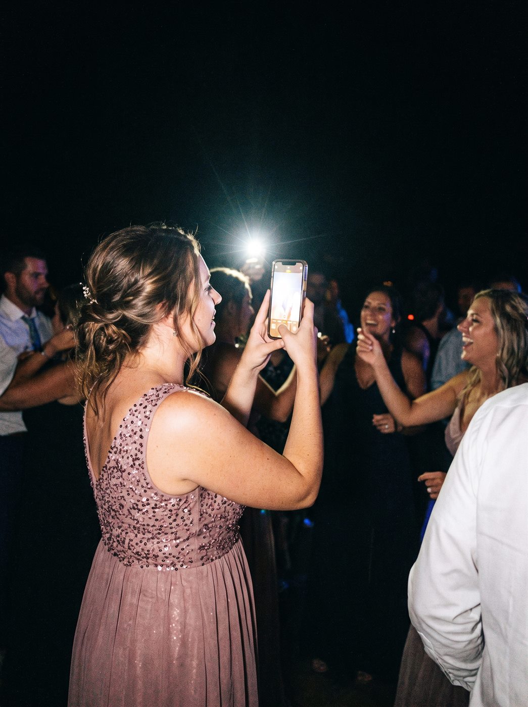 A guest photographing the couple
